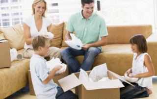 family-in-surry-hills-packing-their-items-ina-box